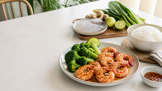 Garlic prawns, broccoli, rice, and simple sauce arranged as a quick seafood dinner